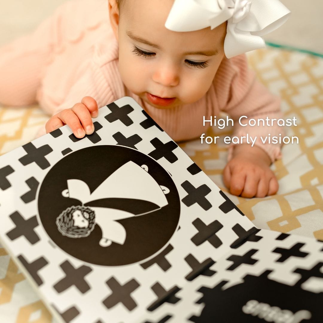 Baby looking at high-contrast book for early vision