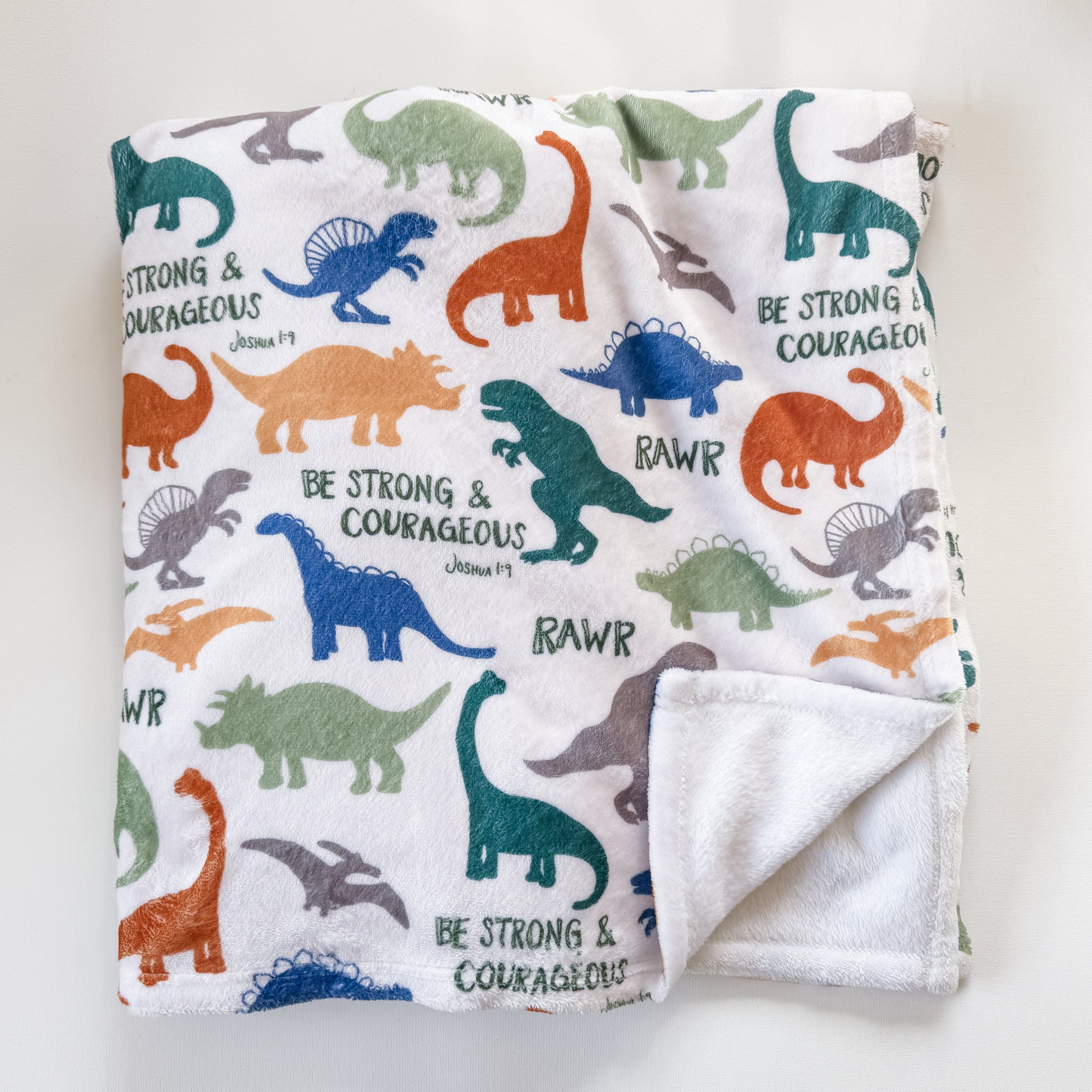Dinosaur Minky blanket with Be Strong & Courageous text.