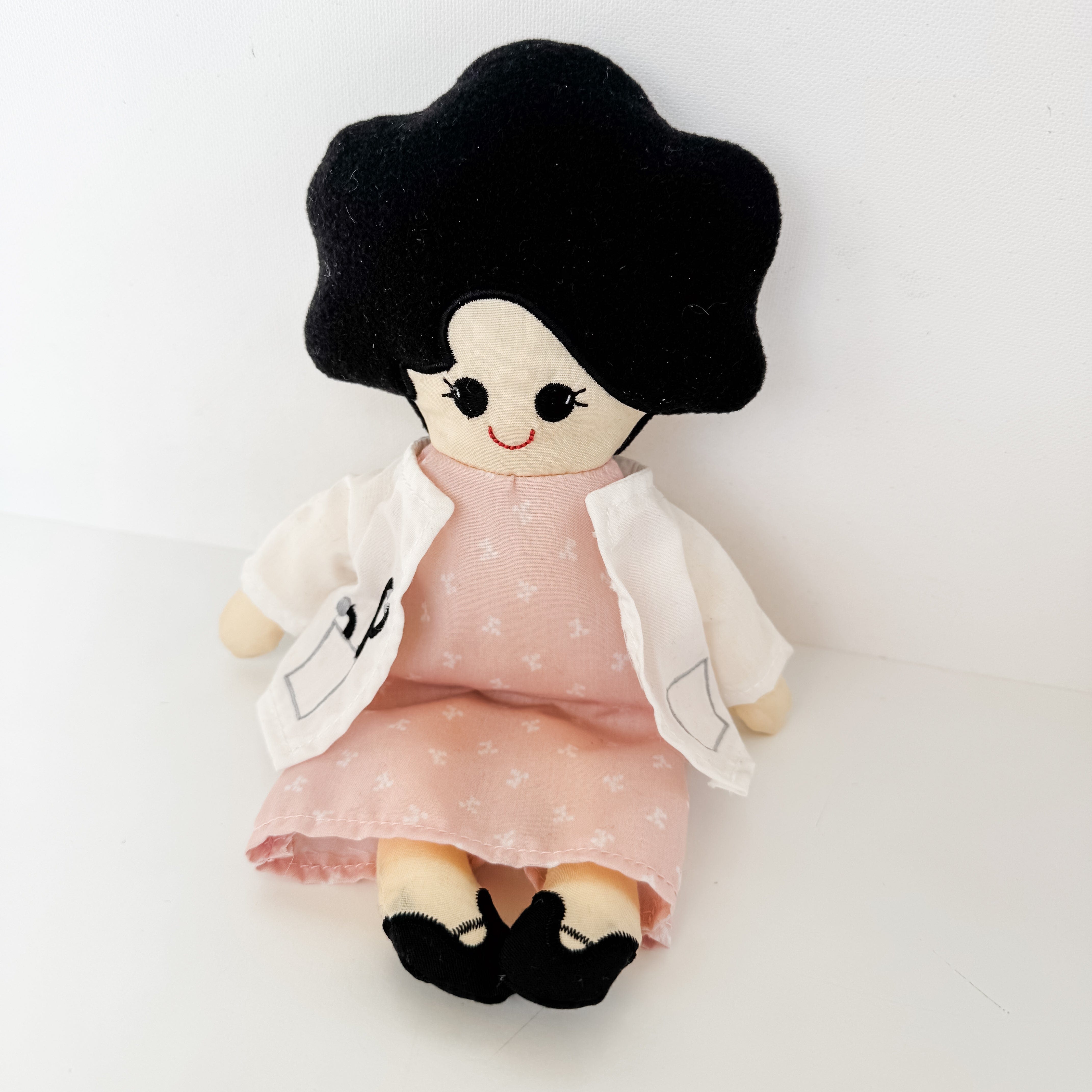 Handmade doll with pink dress and black hair
