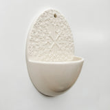 Holy water font with Chi Rho symbol