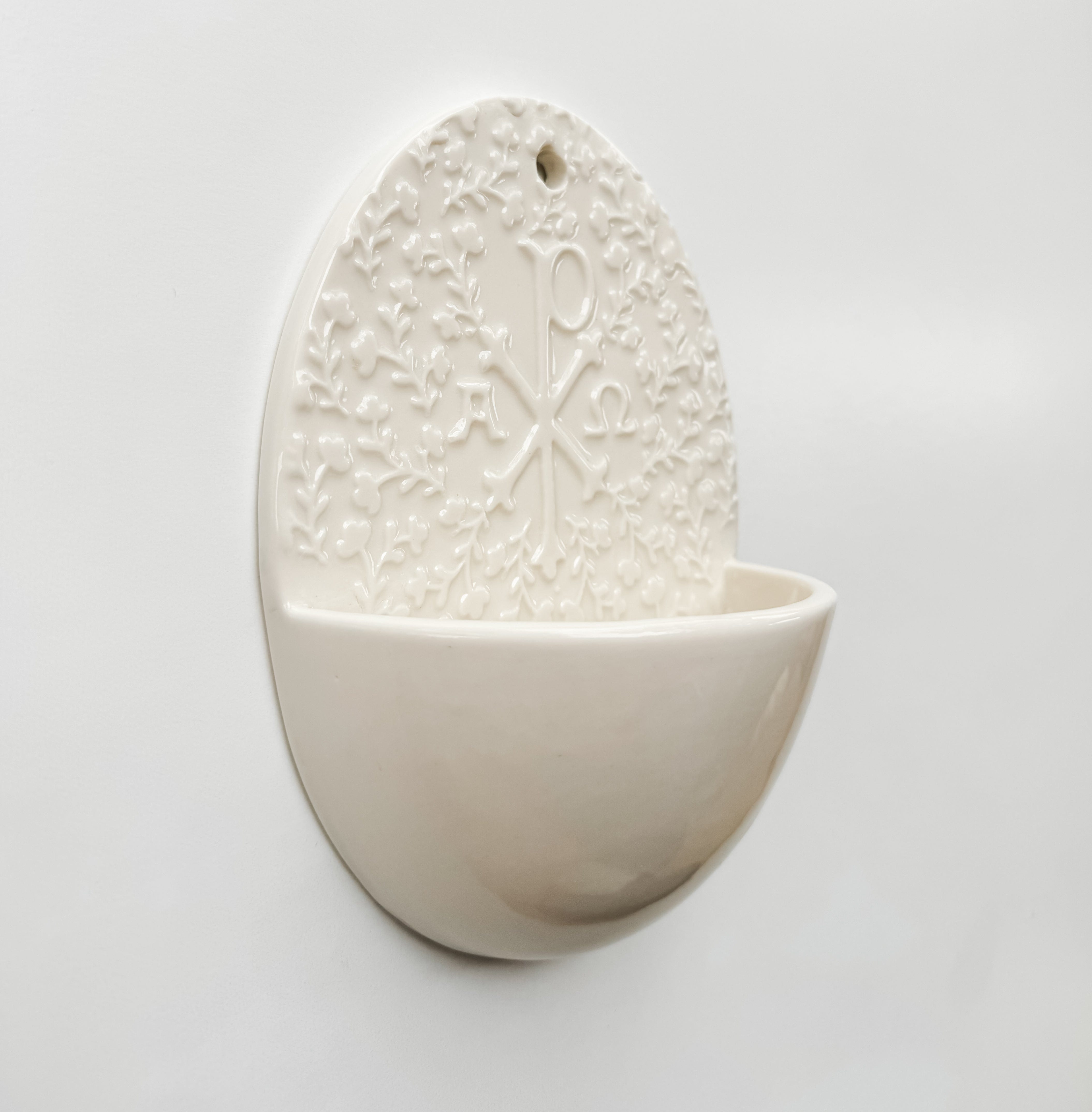 Holy water font with Chi Rho symbol