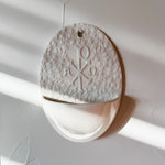 Holy water font with Chi Rho symbol