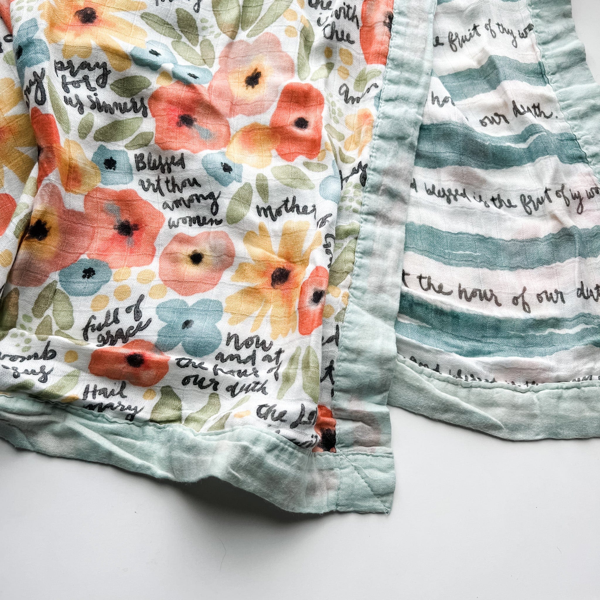 Floral patterned fabric with script and stripes.
