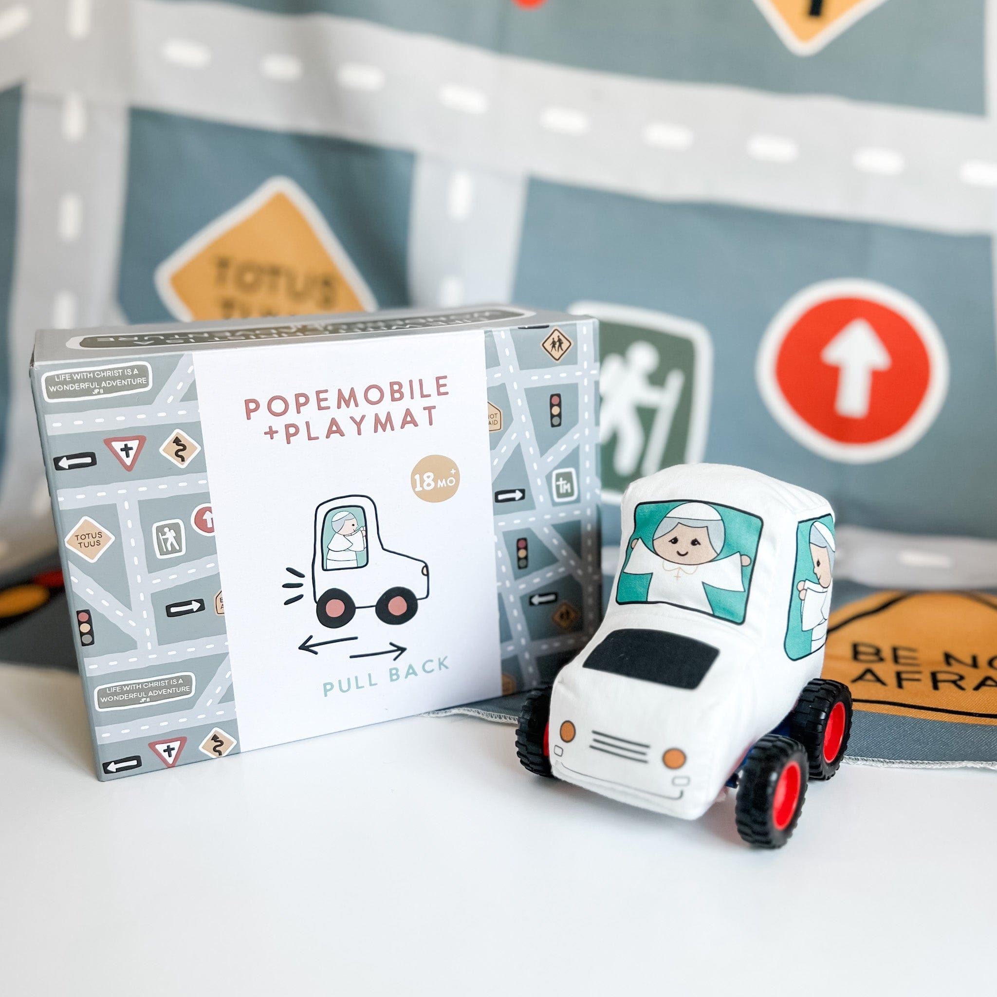 Toy car and box with road signs.