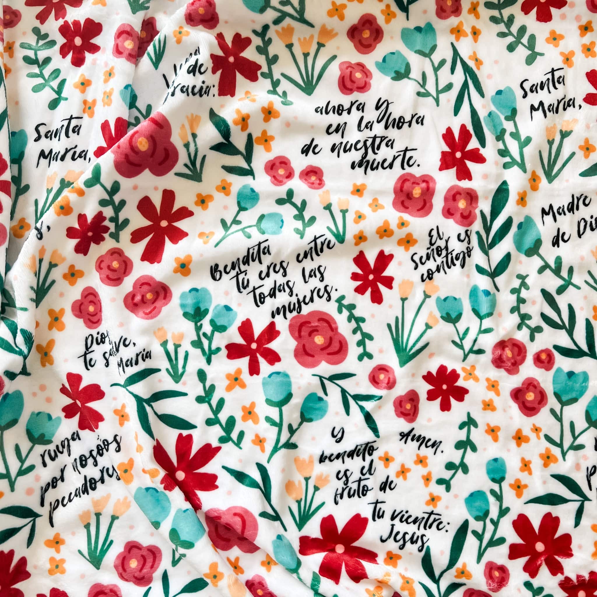 Floral fabric with religious text.