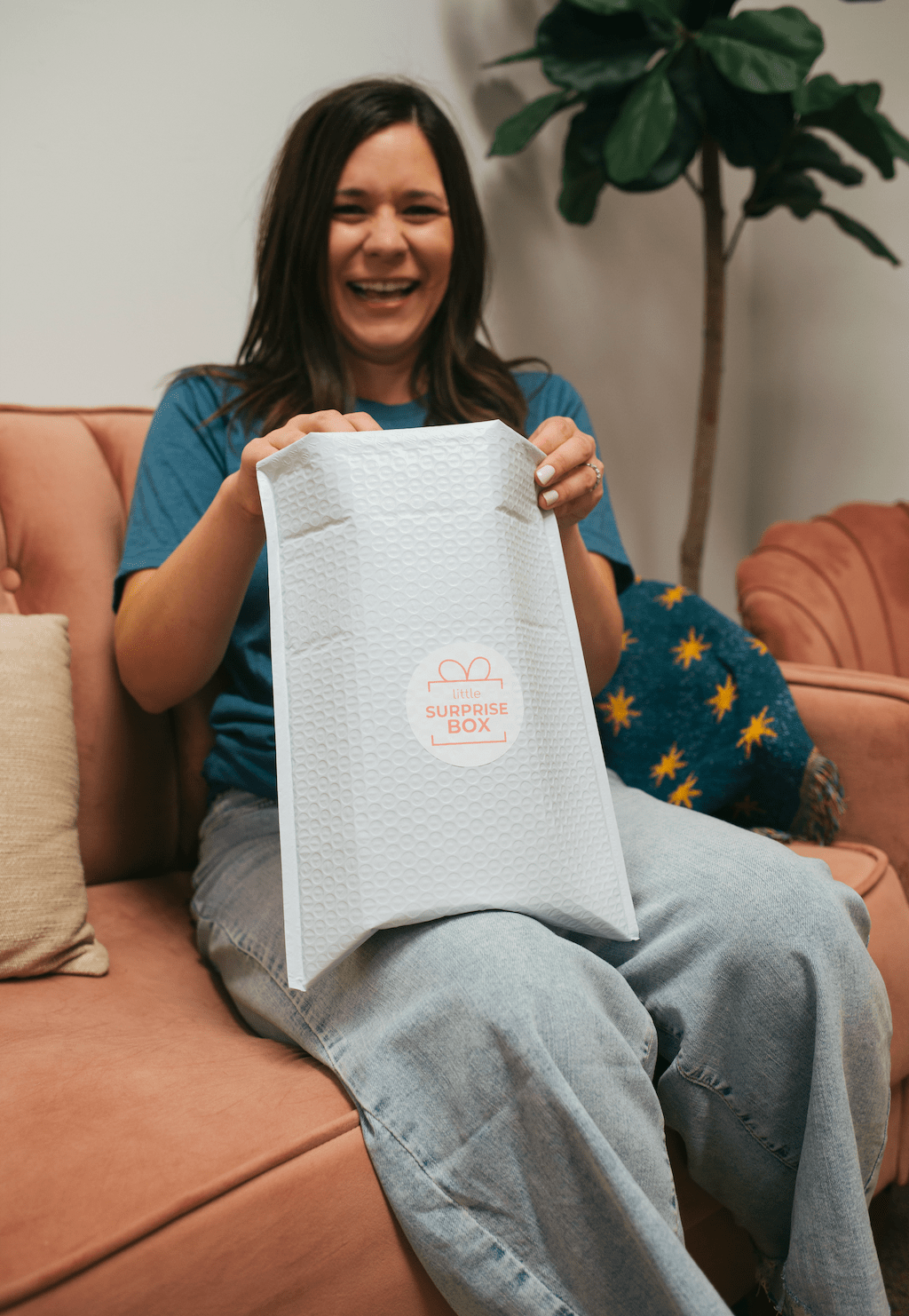 Woman excited to open Surprise Box, July 2024 screenshot