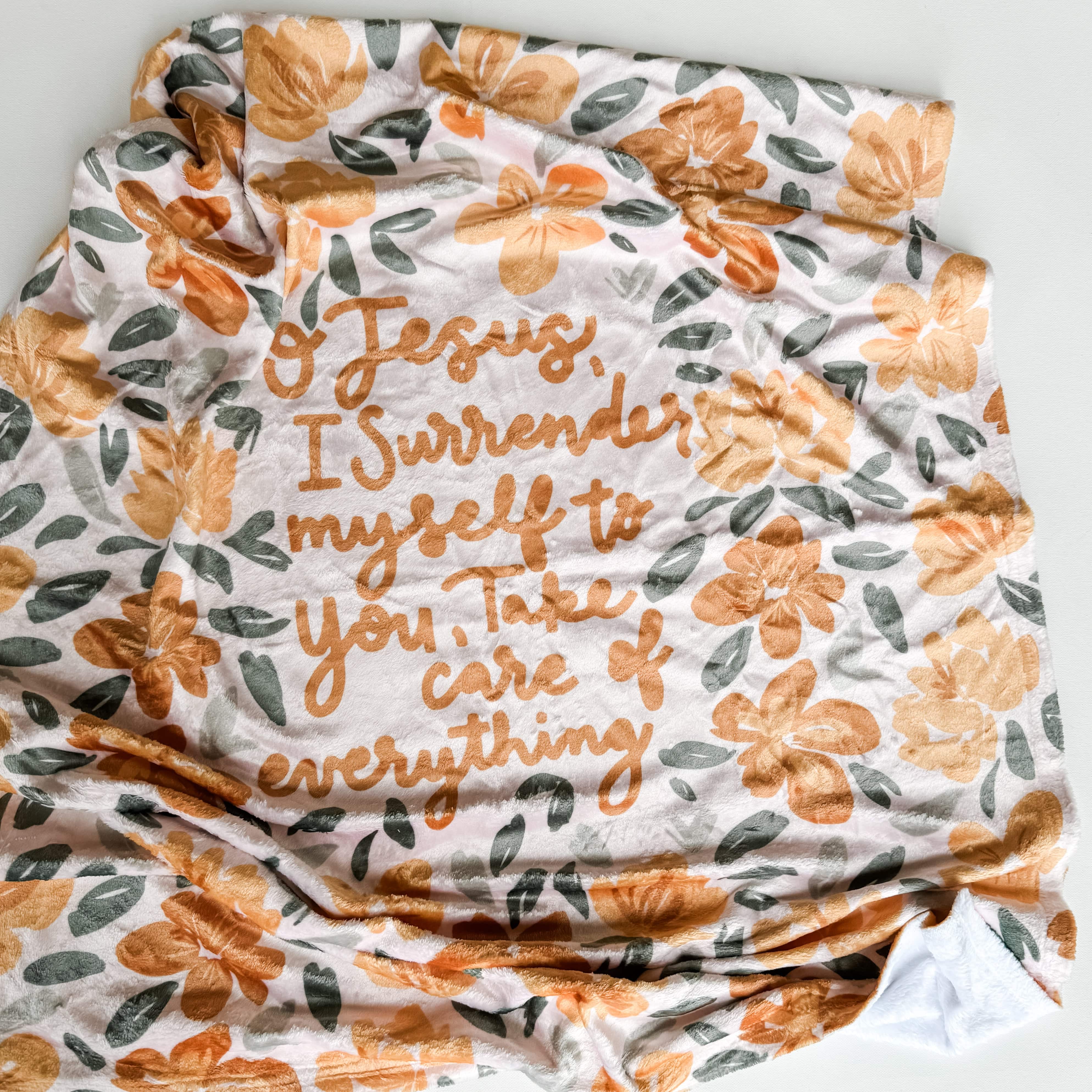 Surrender Minky blanket with floral design and prayer.