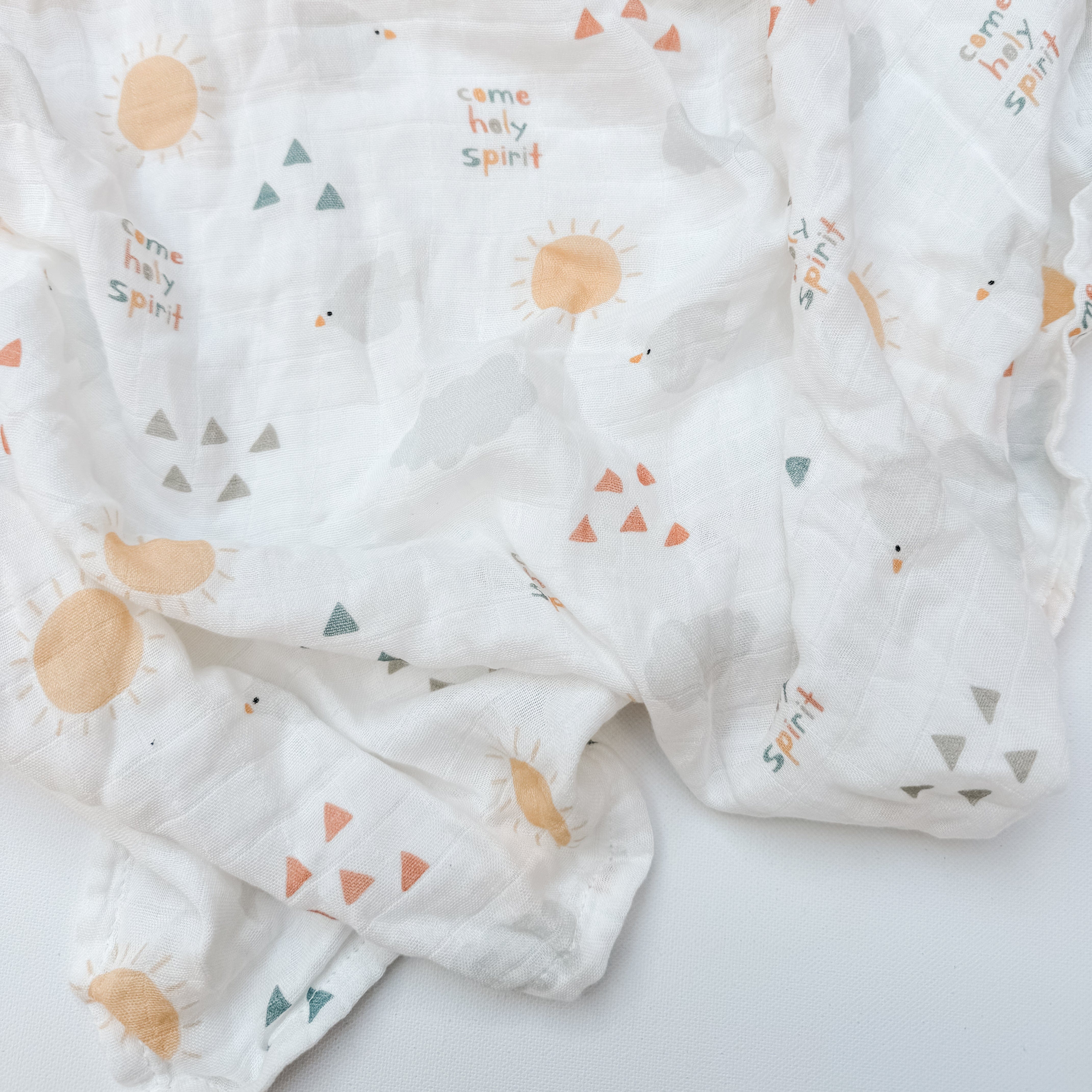 Holy Spirit swaddle blanket with sun and triangle pattern