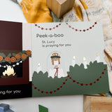 Peek-a-boo St. Lucy praying, flatlay