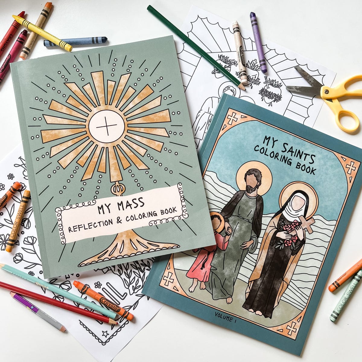My Mass and Saints Coloring Books with crayons