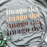 Gray shirt with imago dei text.