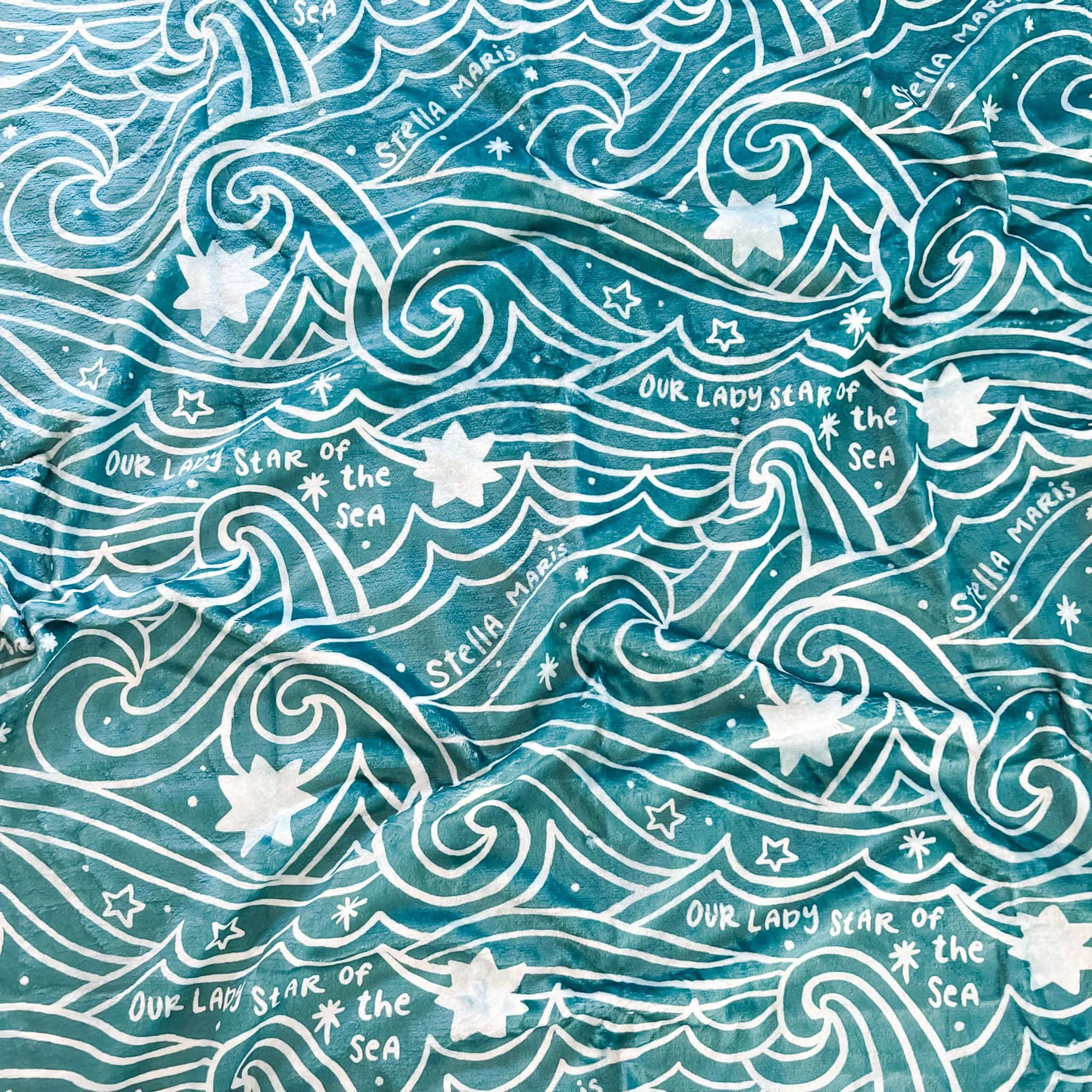 Blue fabric with wave and star pattern.