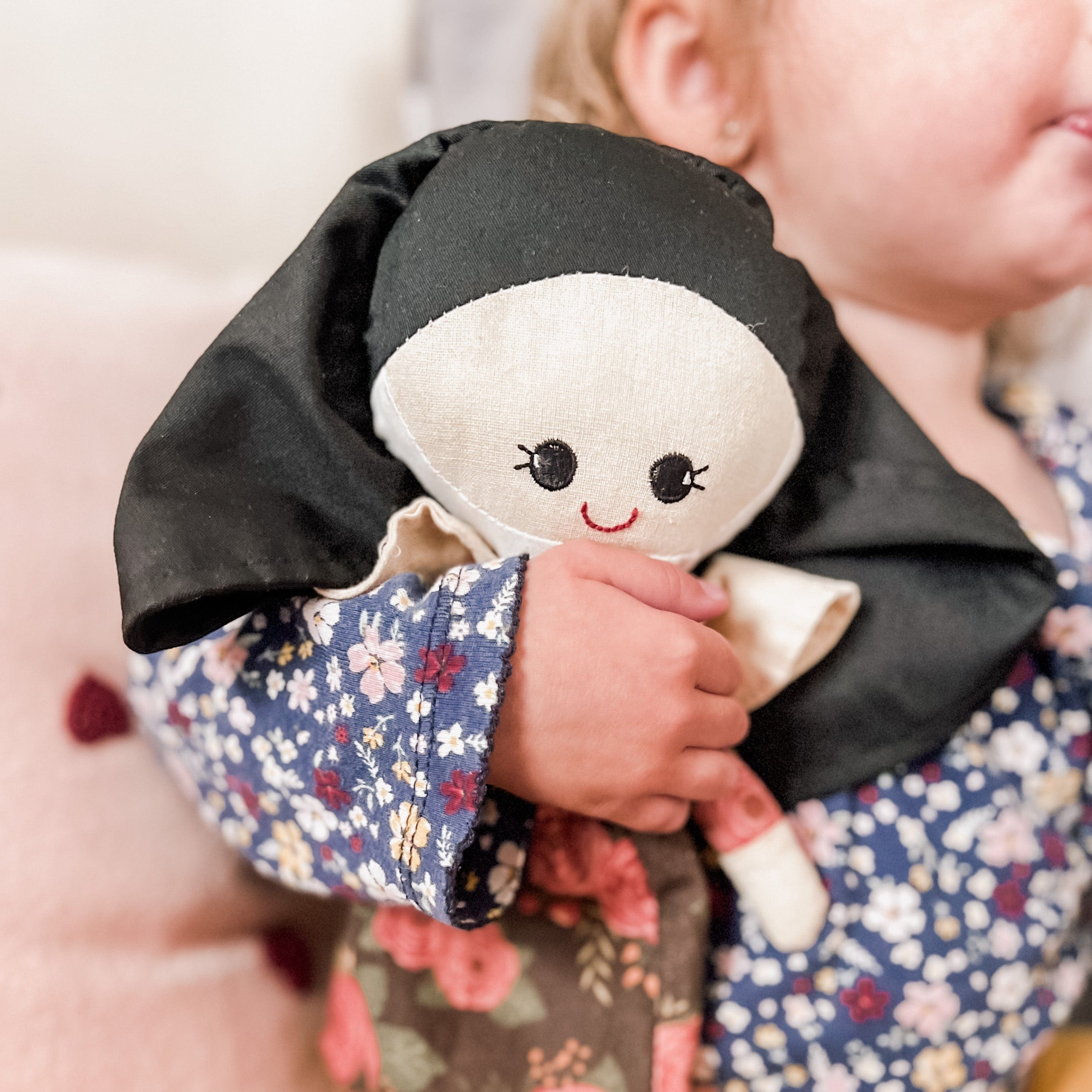 Child holding a nun doll - IMG_3554