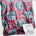 Red blanket with religious symbols.