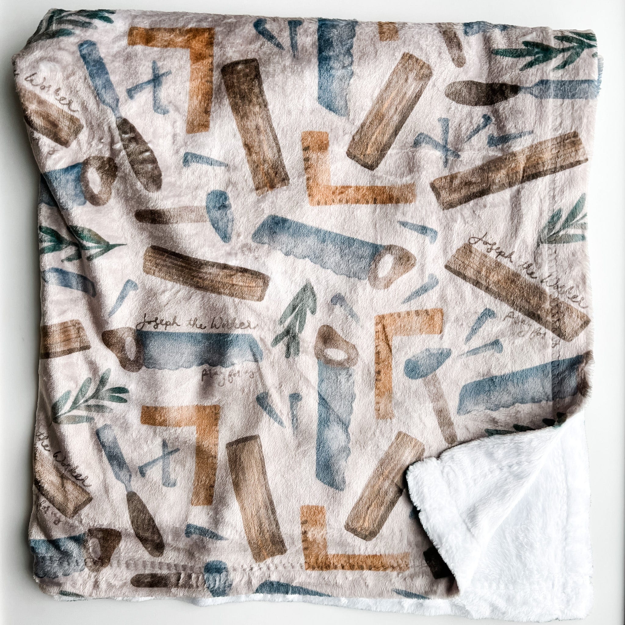 Blanket with carpentry tools pattern.