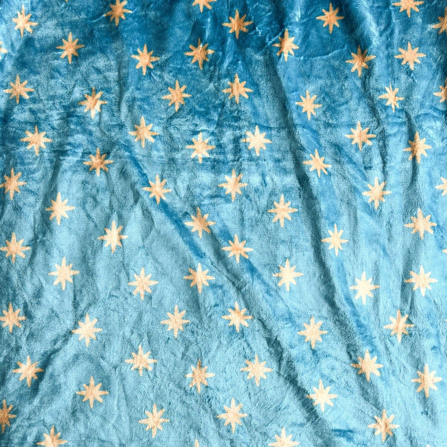 Blue fabric with gold stars.