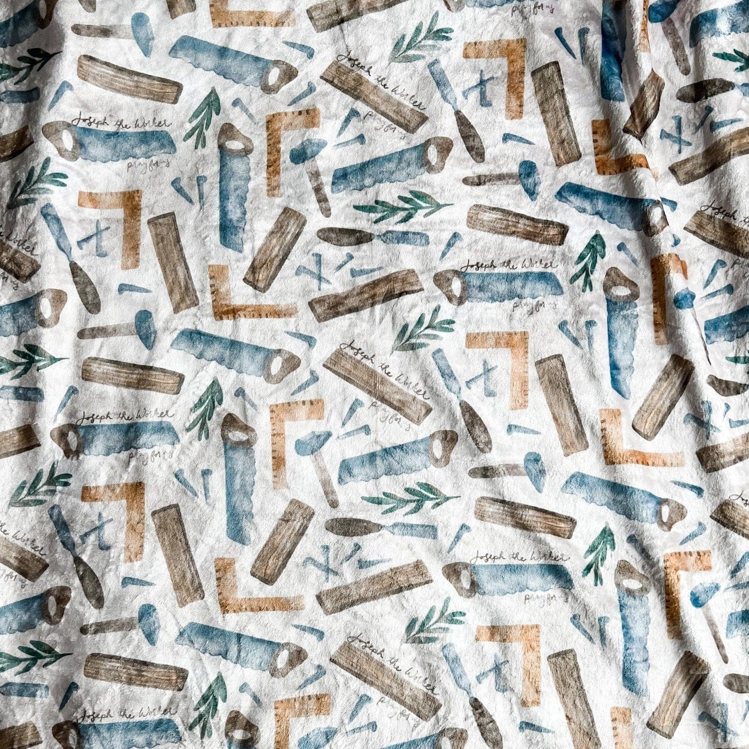 Pattern of wooden and blue watercolor shapes.
