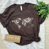 Solovedbrown t-shirt with floral world map design.