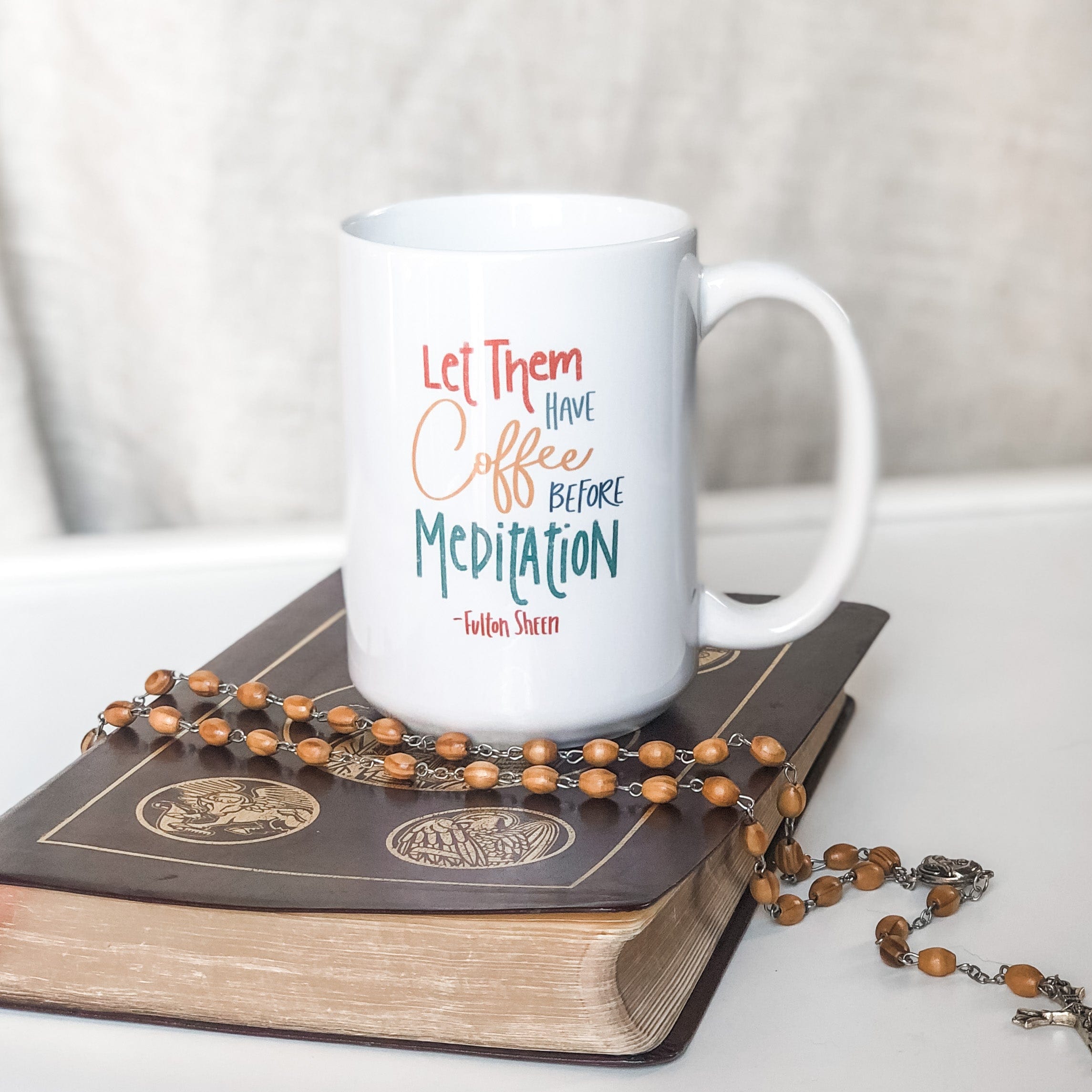 Coffee mug with Let Them Have Coffee Before Meditation quote.