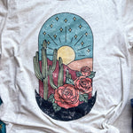 Desert scene with cacti and roses on a t-shirt