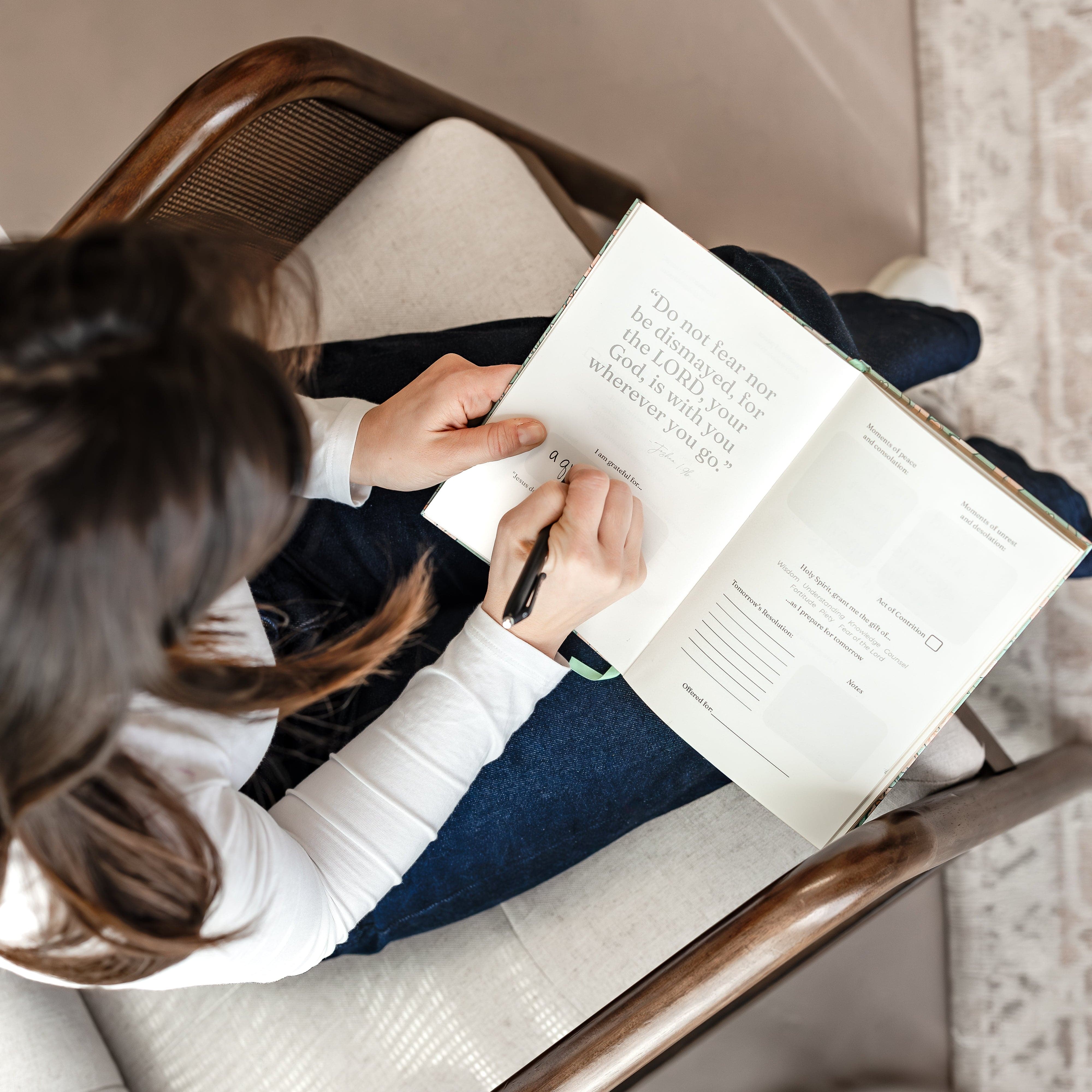 woman journaling daily Examen