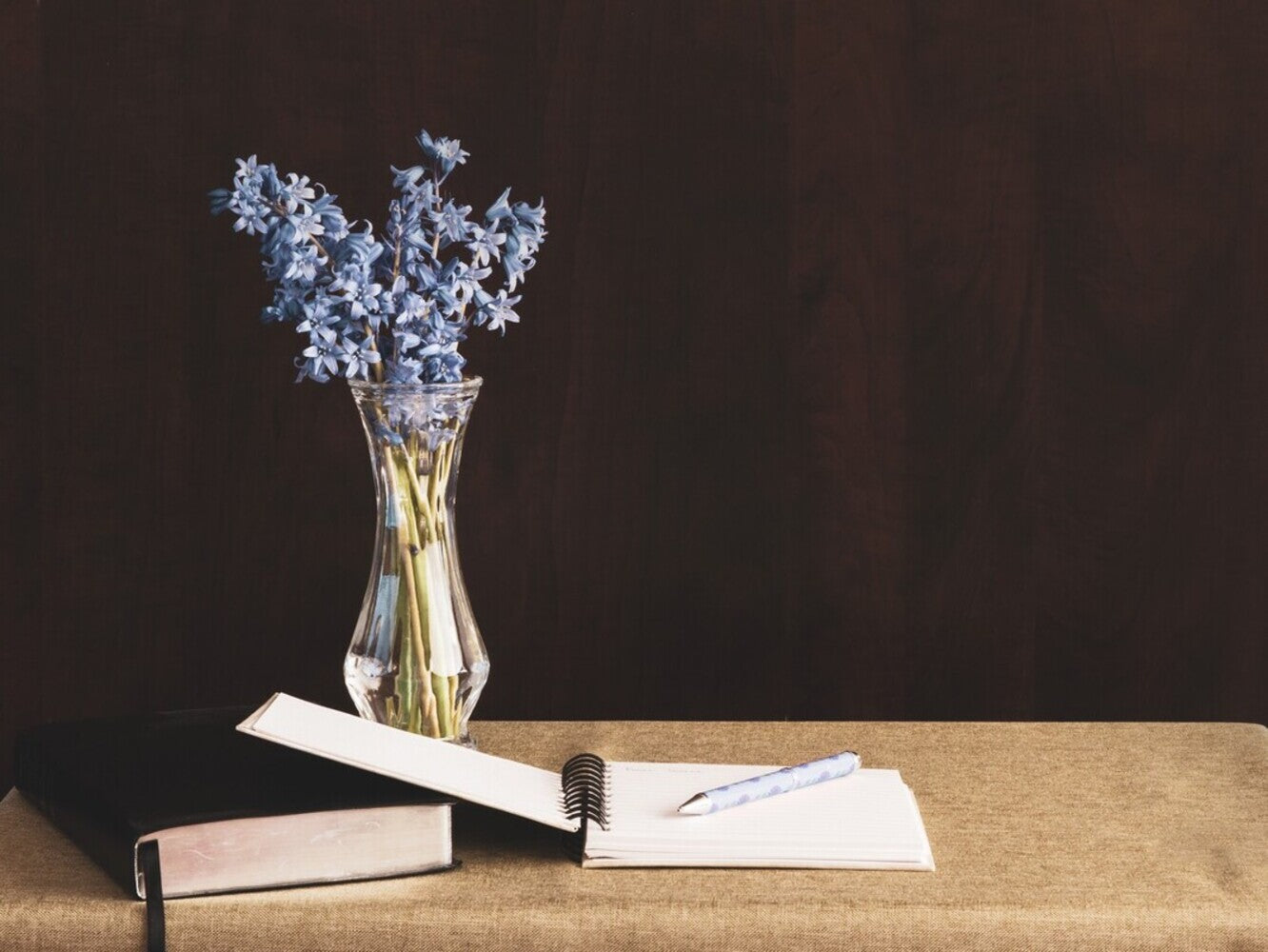Bible and a journal on a table for how to make a prayer journal for beginners