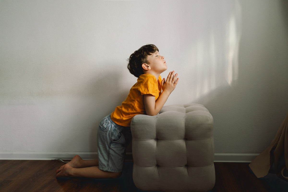 Confirmation gift ideas for boy who is praying on his knees.
