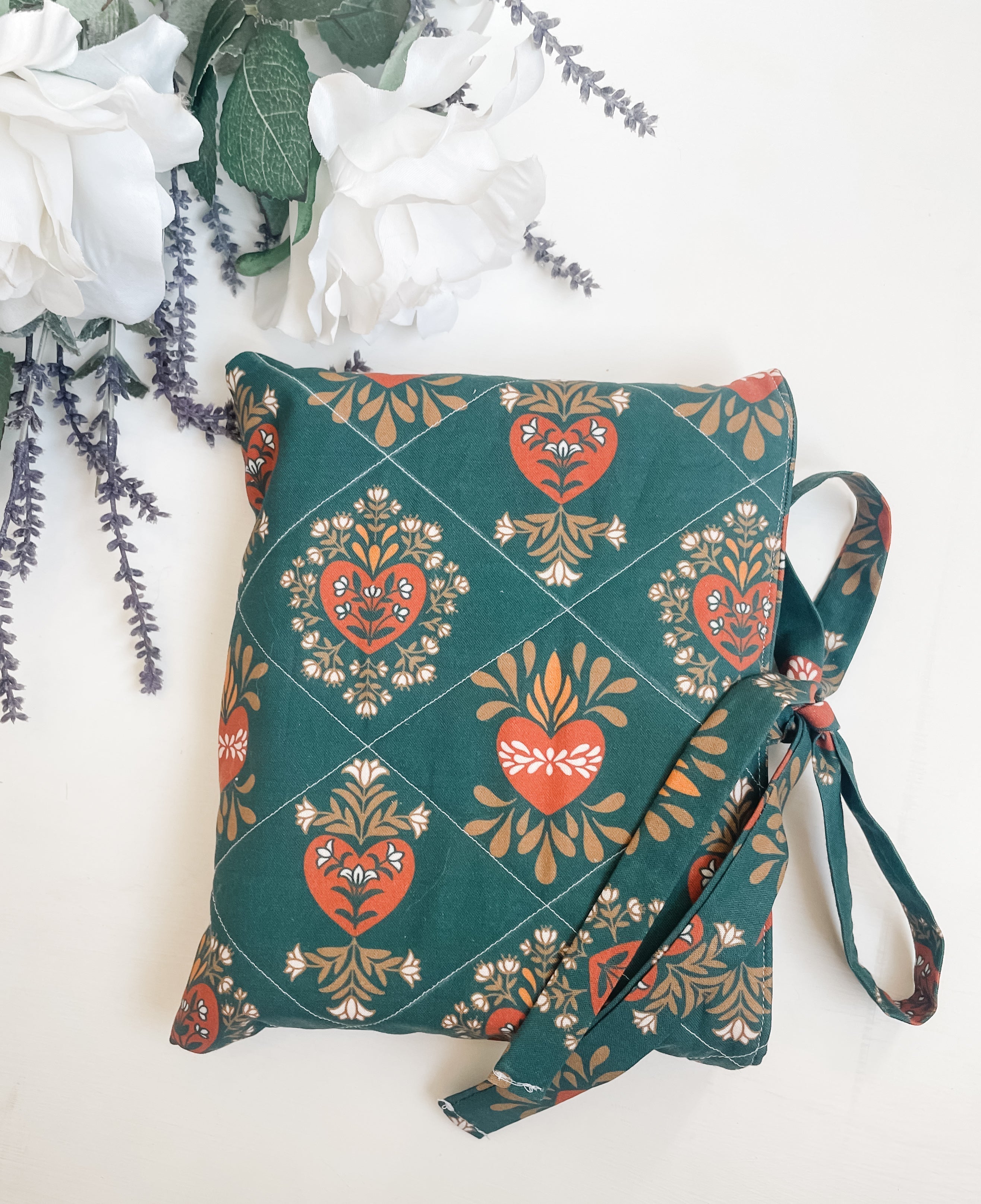 Handmade quilted Bible cover in Holy Family fabric used for daily Scripture reading