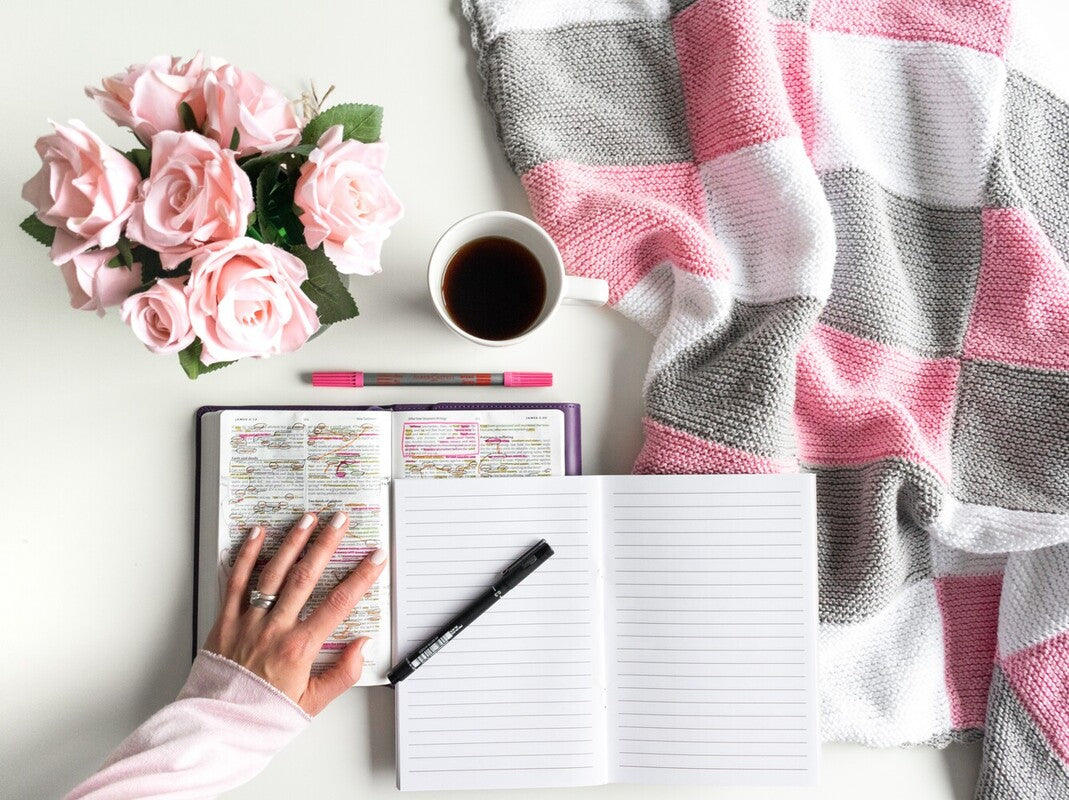 woman showing how to journal as a Christian by journalling alongside reading her Bible