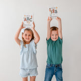 children holding catholic ABC and 123 board book