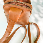 Brown crossbody bag product detail, open zipper