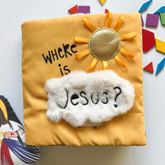 Yellow fabric book with text and sun decoration.