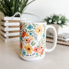 Floral mug with plants in the background
