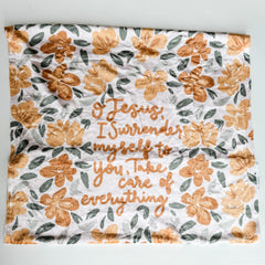 Surrender Minky blanket with floral design and inspirational quote.