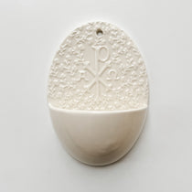 Holy water font with Chi Rho symbol