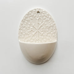 Holy water font with Chi Rho symbol