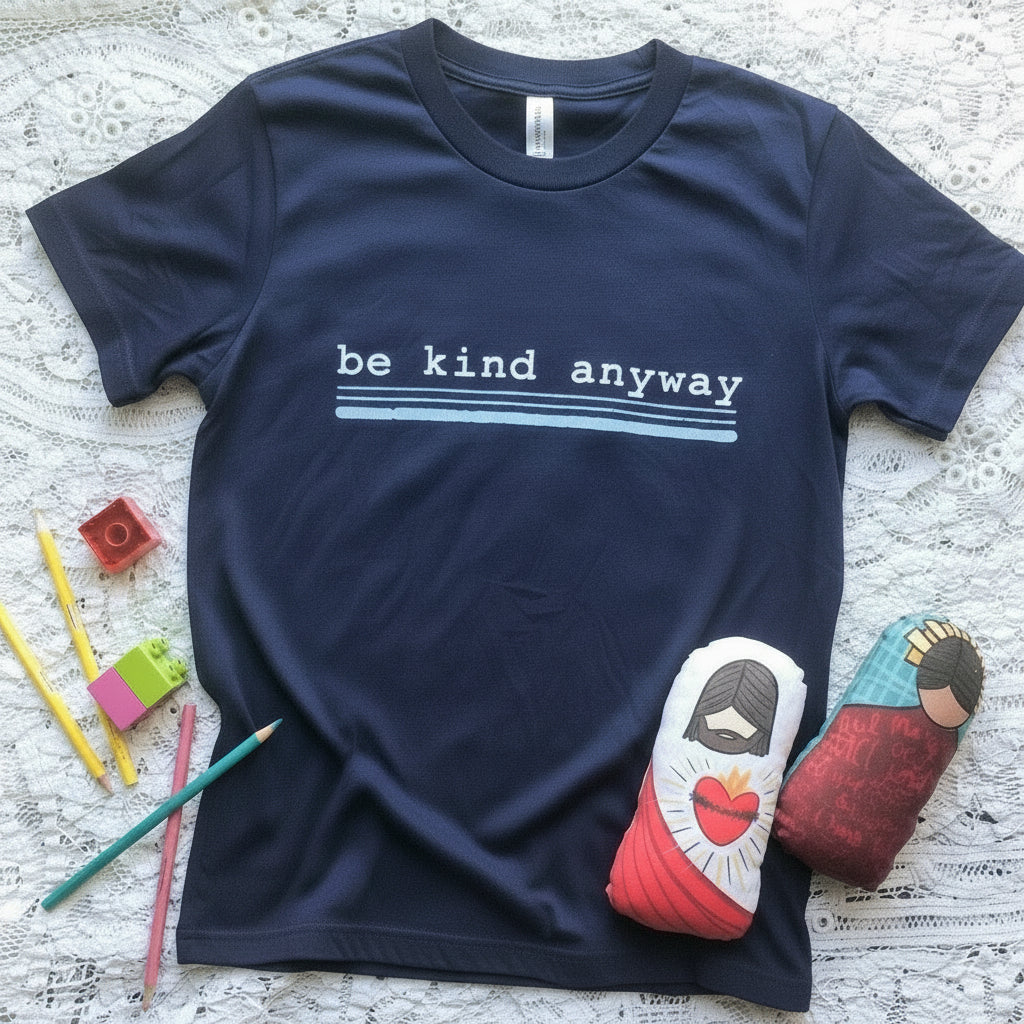 Navy t-shirt with be kind anyway text and small toys.