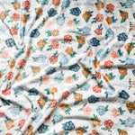White floral fabric with inspirational words.