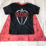 Black t-shirt and red cape with crosses.