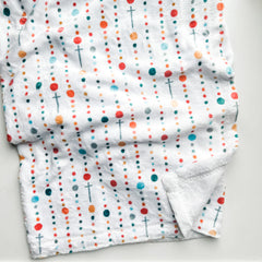 White fabric with colorful dots and crosses.