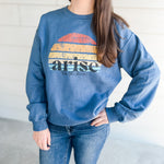 Woman wearing blue arise sweatshirt.