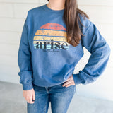 Woman wearing blue arise sweatshirt.