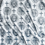 White fabric with repeating religious symbols.